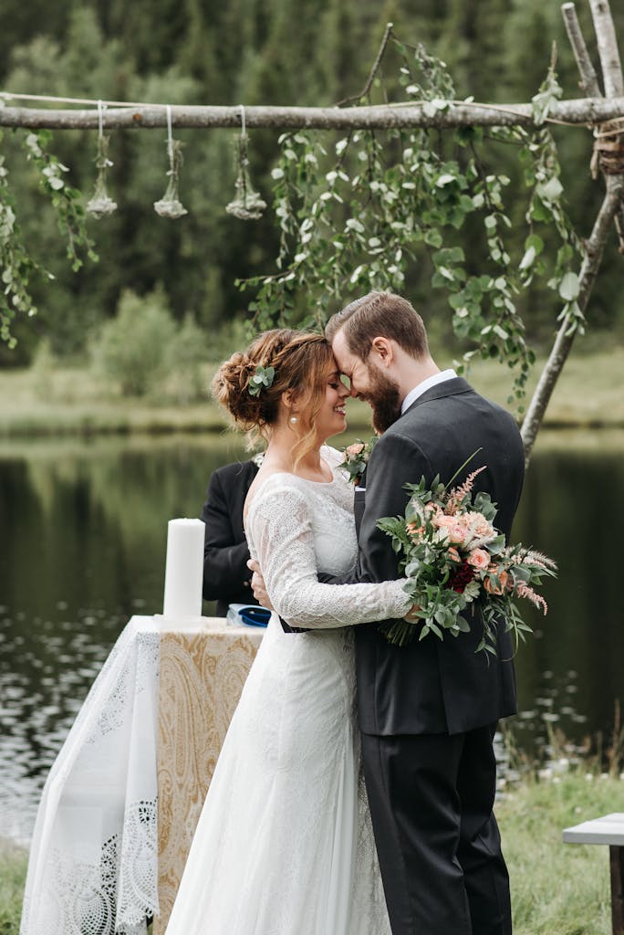 Photo of a Romantic Couple Head to Head on Their Wedding